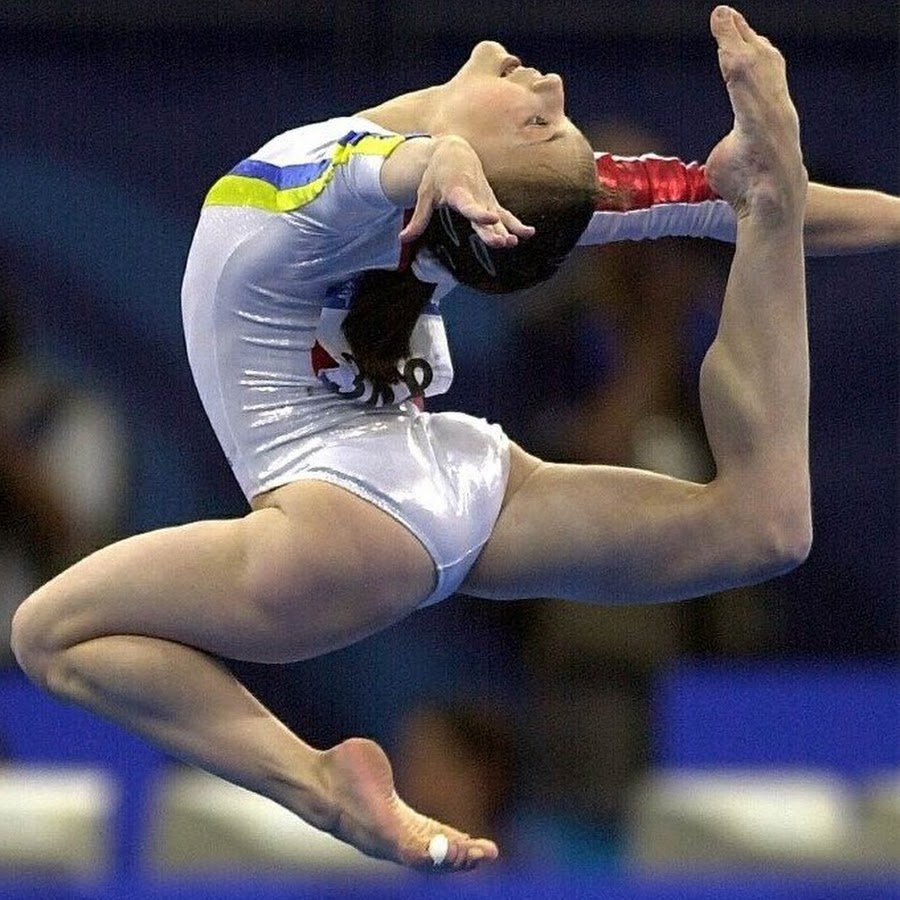 The silhouette of the ballerina gymnast
