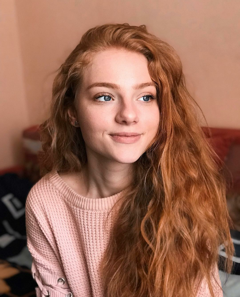 Julia Adamenko in a dress