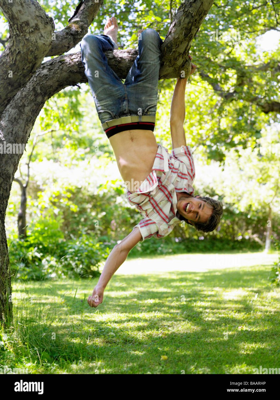 A person hangs upside down a reference