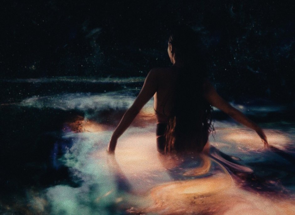 Ariana Grande painting God pulls a hand