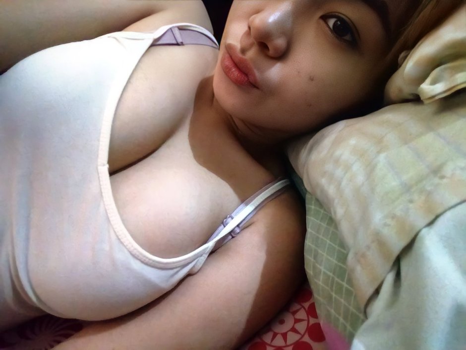 Girl in a hijab shows her chest