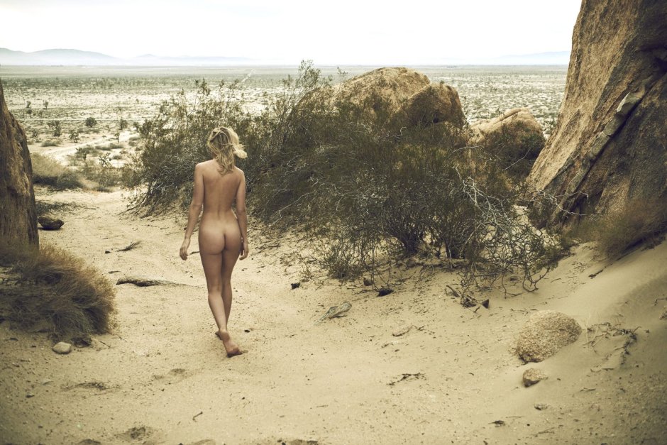 Naked blonde in a sandy career