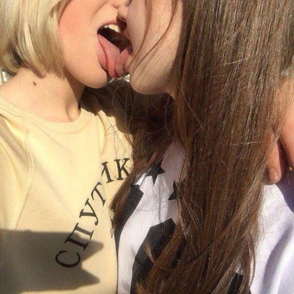 Two girls with a tongue