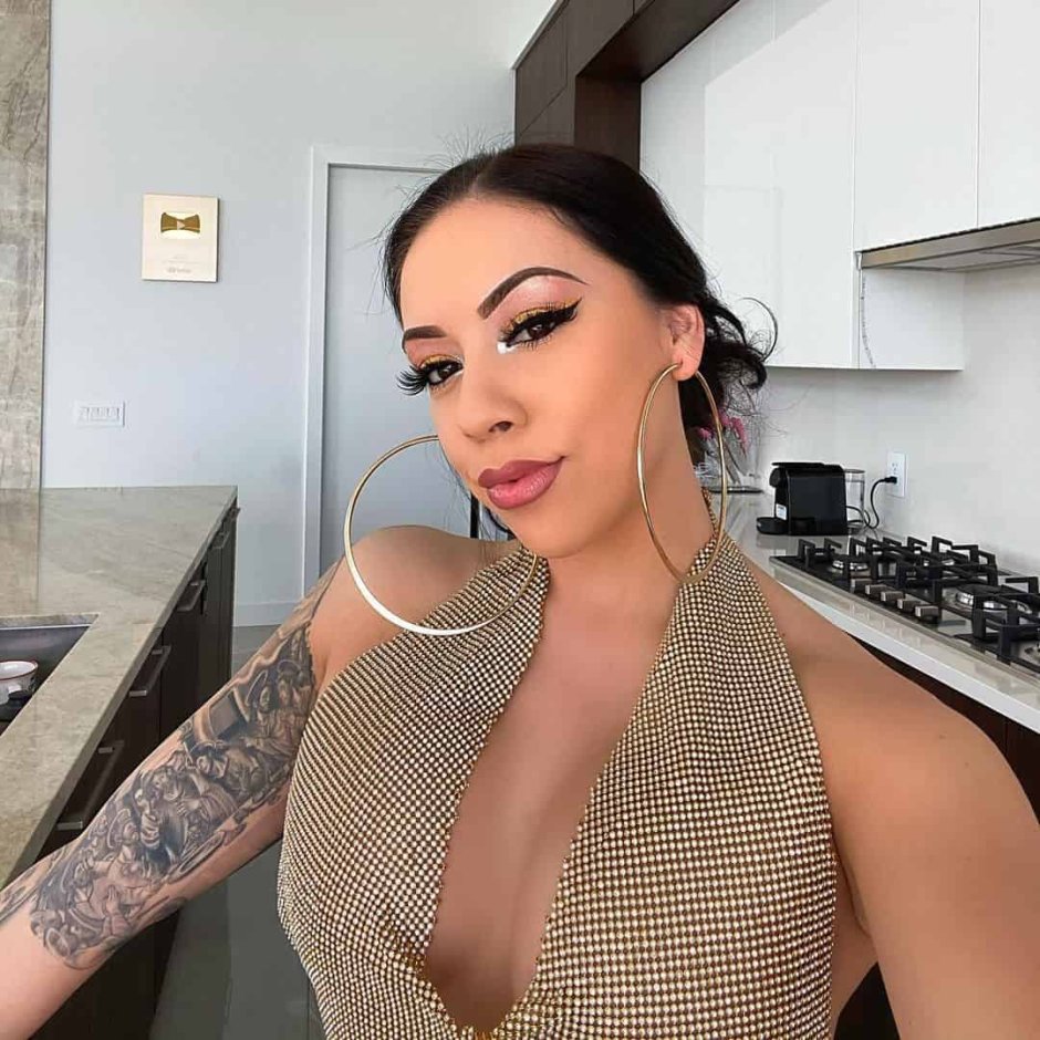 Porn actress with a tattoo on the vertebra