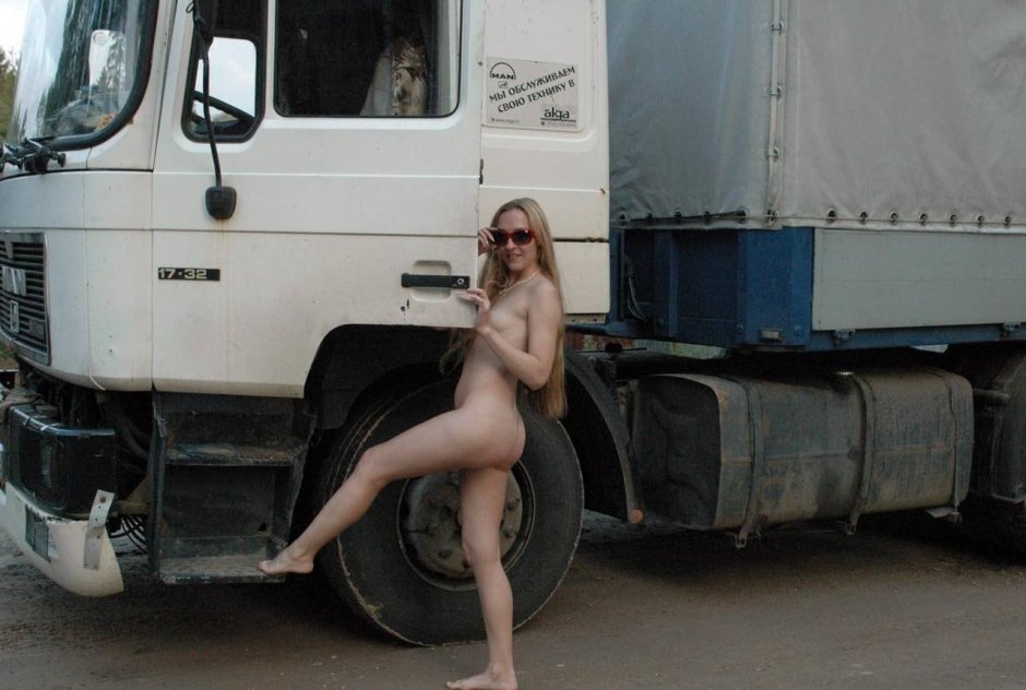 The girl undressed in the cockpit of the truck