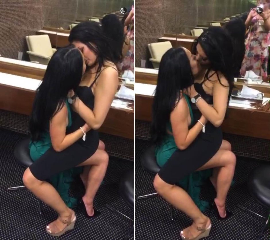 Schoolgirls kiss each other