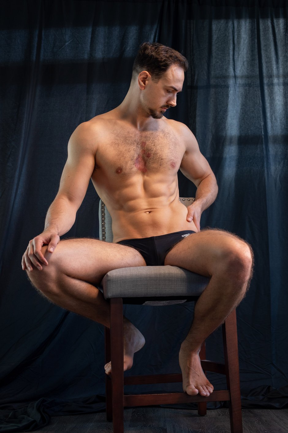 Man sits naked reference