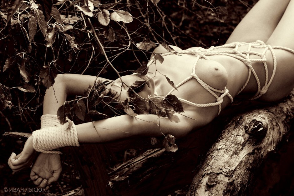The girl is tied to a tree