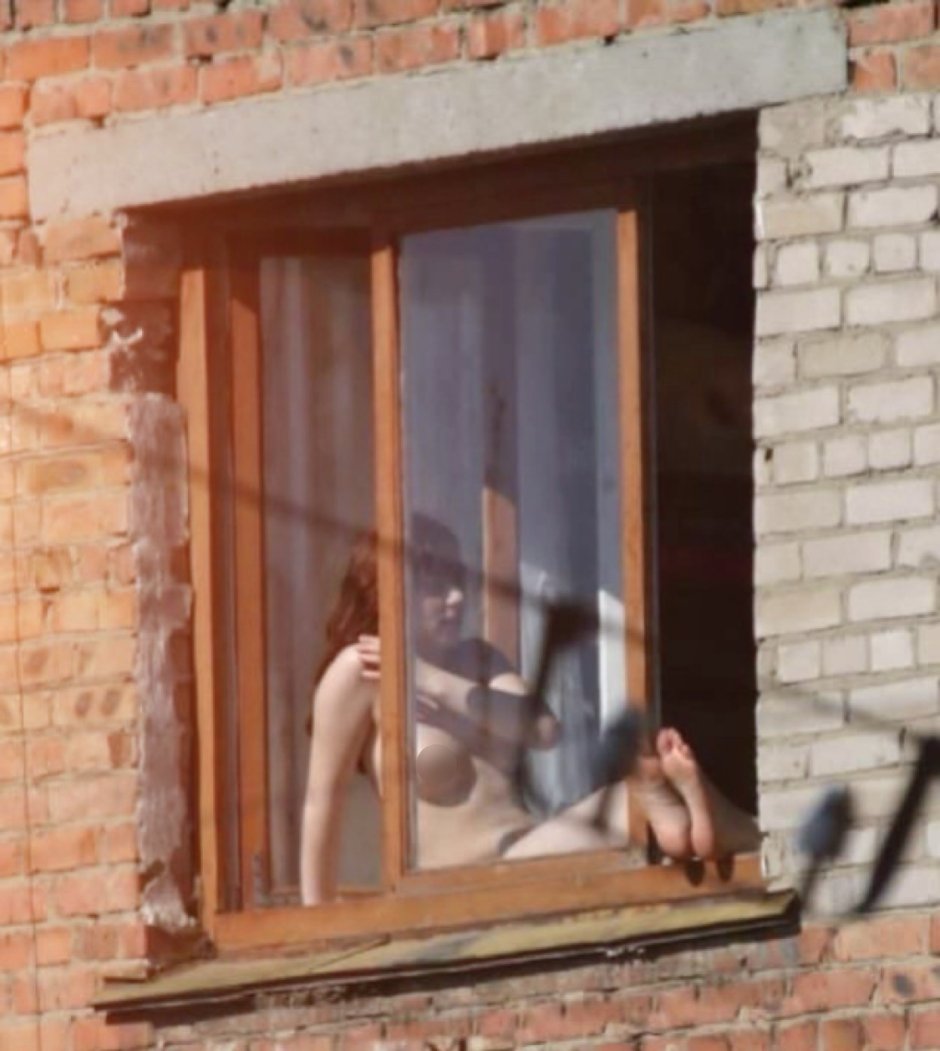 Peeping out the windows behind the naked