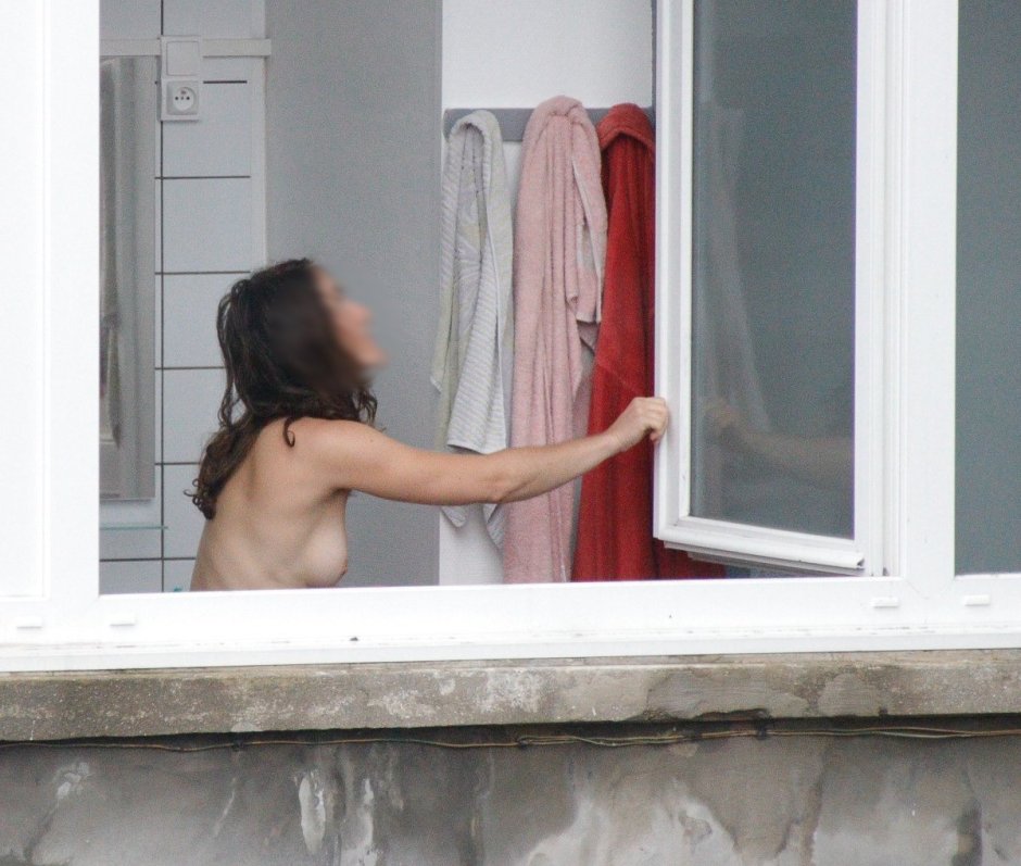 Naked in the window lit up