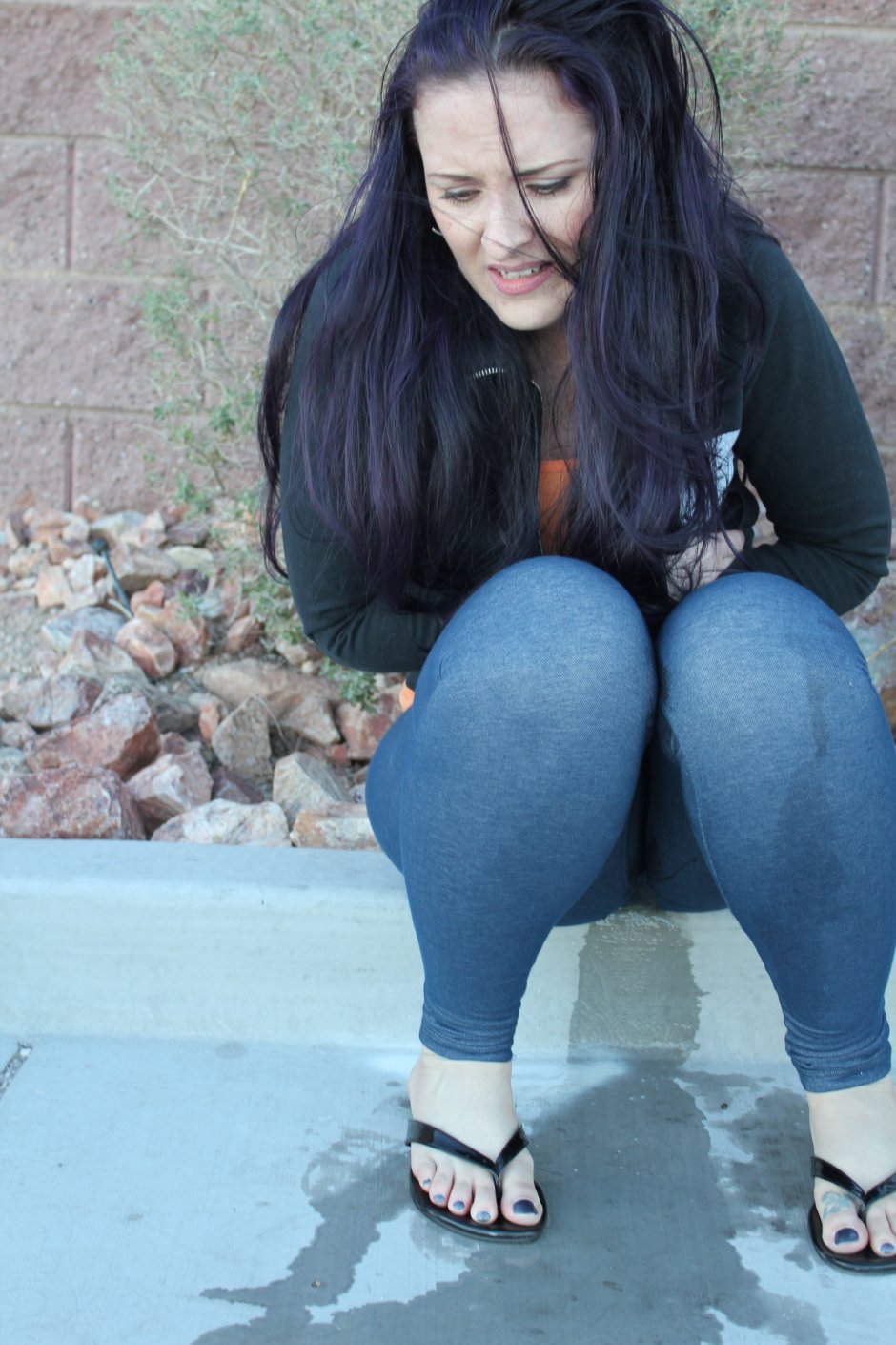 Pissing in jeans on the street