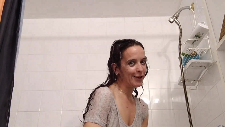 Brunette poses in a foam bath