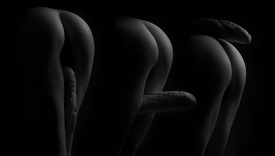 Naked butt on a black background