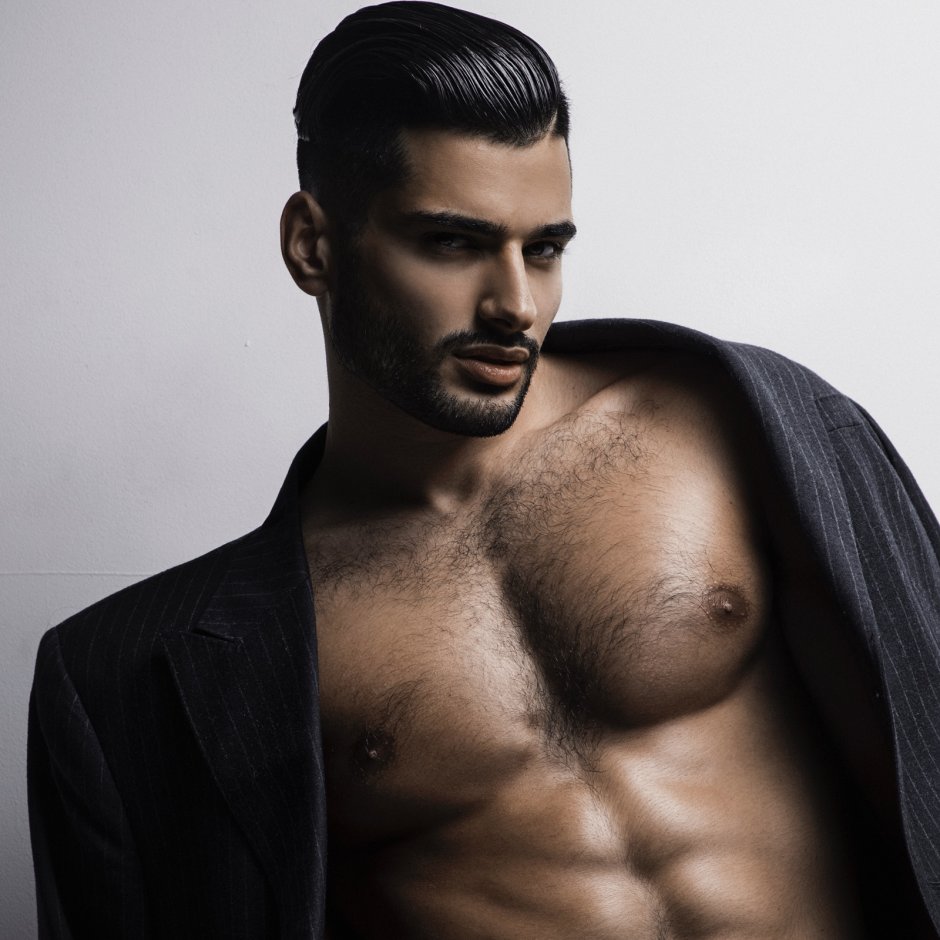 The guy holds the girl by the chest black