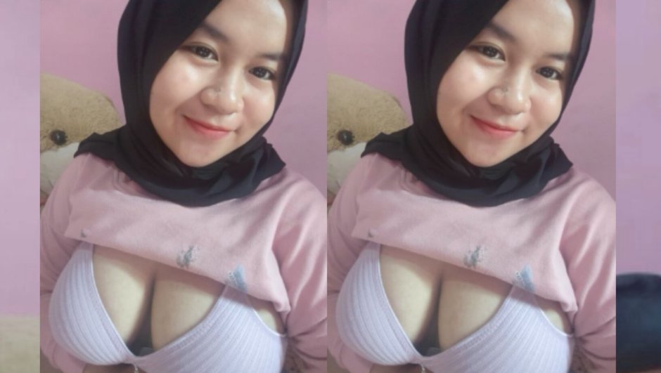 Girl in a hijab shows her chest