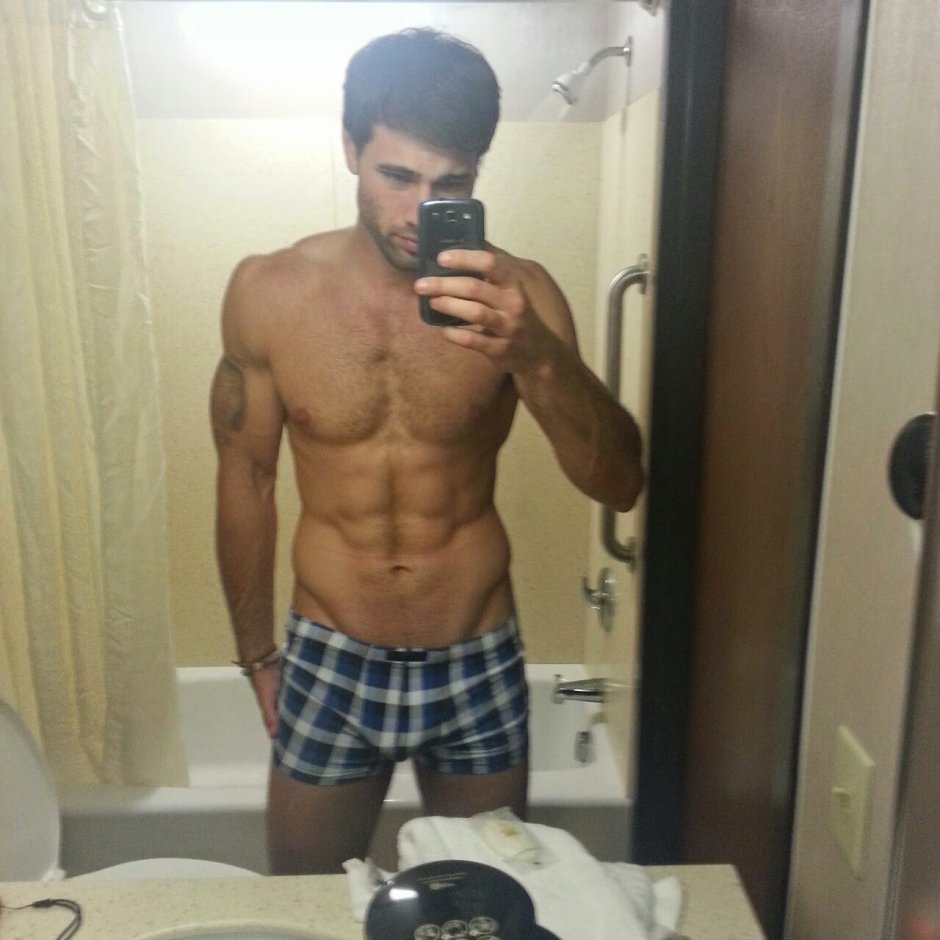Male asses in swimming trunks