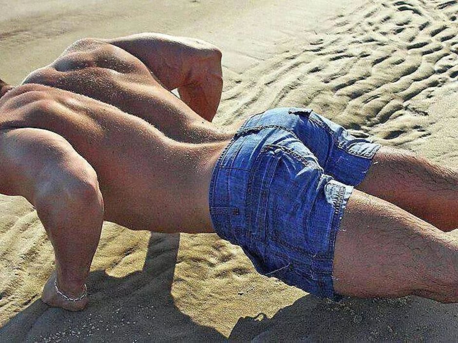 Boy on the beach from the back