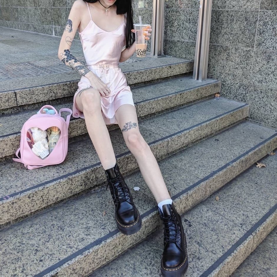 In a mini skirt on a skateboard