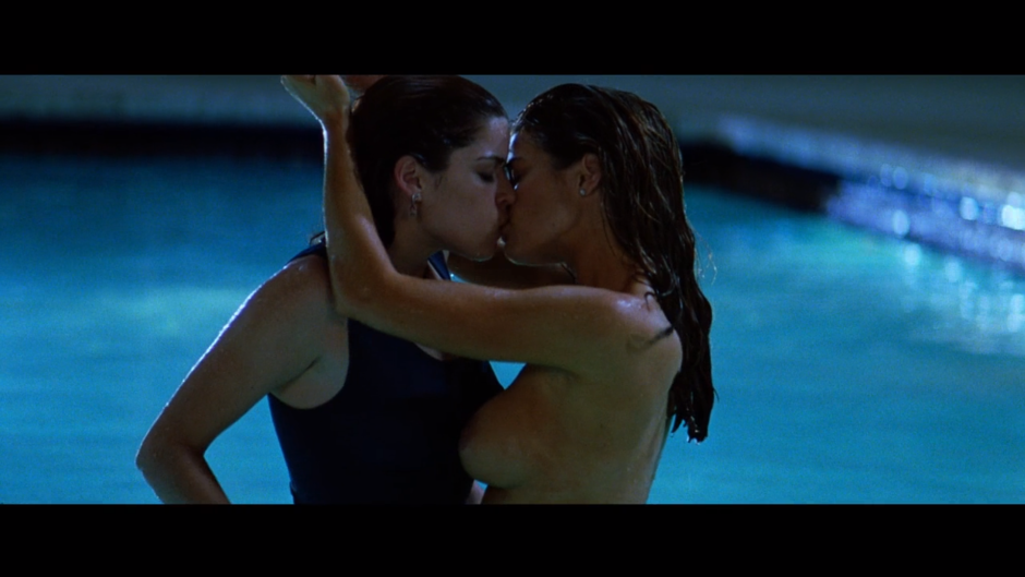 Niv Campbell and Denise Richards in the pool