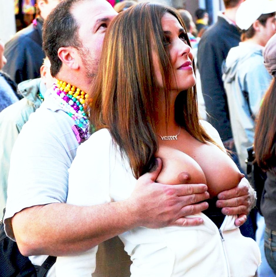 Girl shows boobs passers -by