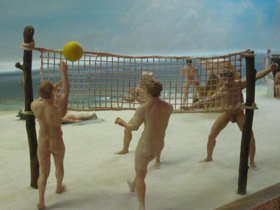 Naked beach volleyball players