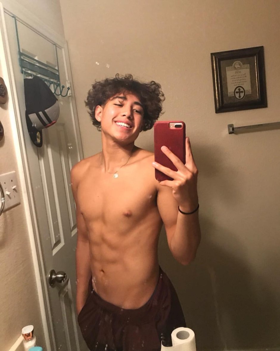 Handsome boy with curly hair masturbating