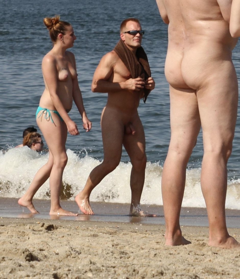 Naked men and women on the beach