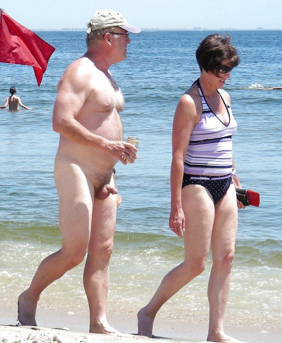 Naked men dressed women on the beach