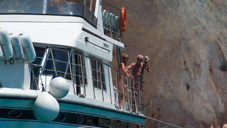 Family of nudists by Sea Float by the Boat