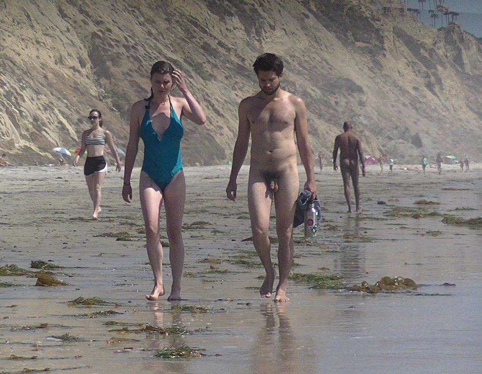Dressed women naked guys on the beach