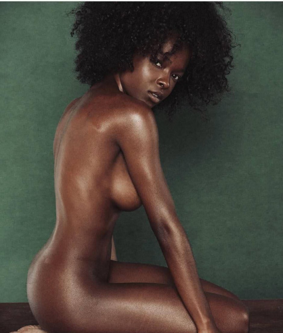 Naked mulatto with Afro hairstyle