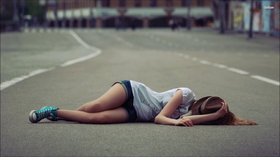 Girl lies on the road
