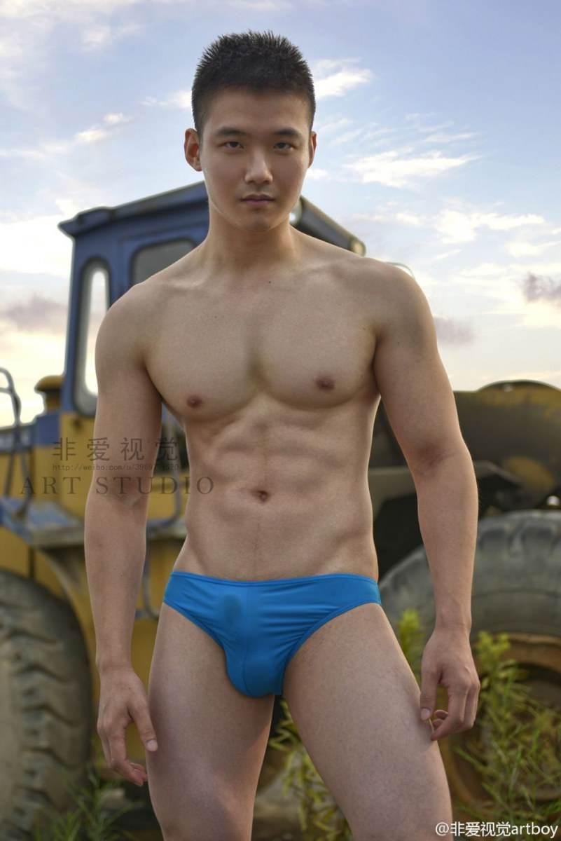 Asian guys in swimming trunks