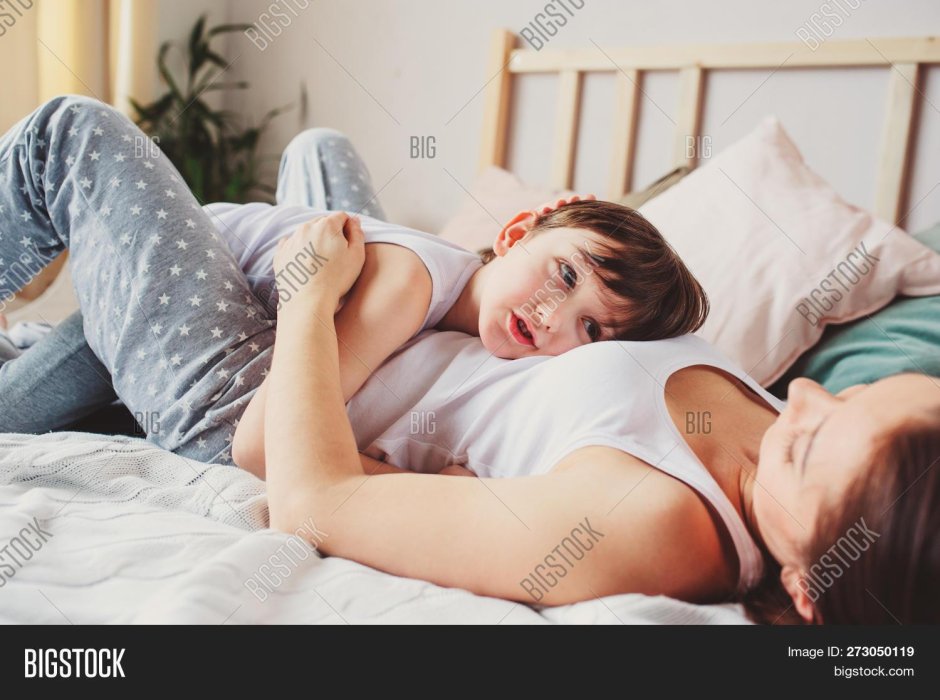Mom and a teenager in bed